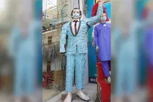 10-ft mannequin in suit made of 250 masks is here to remind you to wear masks 10-ft mannequin in suit made of 250 masks is here to remind you to wear masks