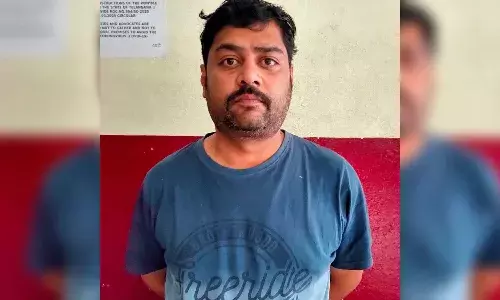 One held for scamming people through phone calls