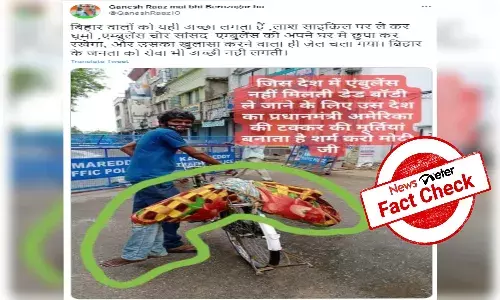 Man carrying body on cycle