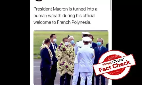 Viral image of heavily garlanded French President Macron is morphed