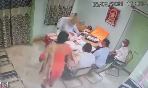 Video : Vizag woman officer barges into office meeting, throws sand at Deputy Commissioner