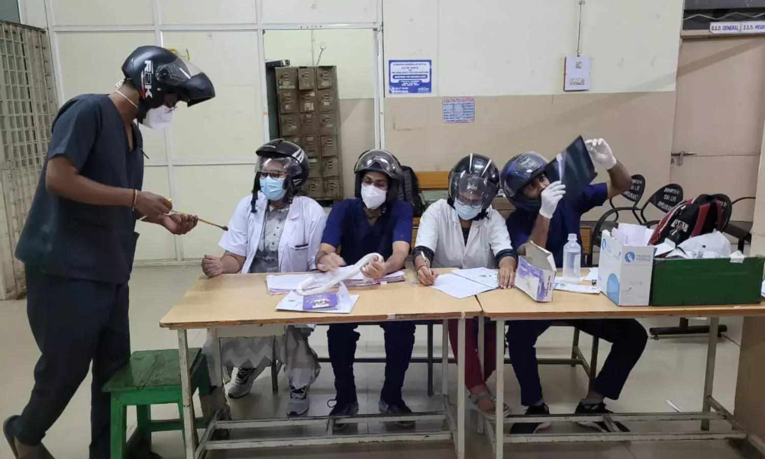 OGH doctors work wearing helmets protesting unsafe working conditions