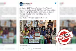 Fact Check: Morphed photo shows group of people holding No road on Indo-China border placard Fact Check: Morphed photo shows group of people holding No road on Indo-China border placard
