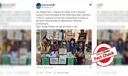 Fact Check: Morphed photo shows group of people holding No road on Indo-China border placard