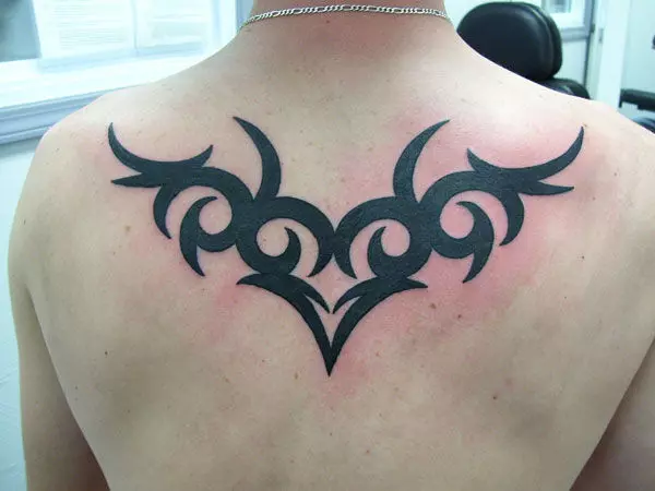 Eagle tribal tattoo on upper back