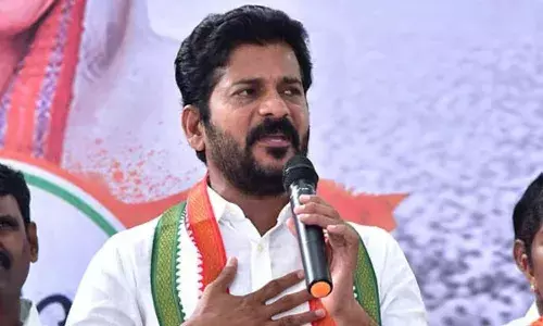 TRS MPs boycotted Parliament to stop ED probe against KTR into Rs. 3,000 cr land scam: Revanth TRS MPs boycotted Parliament to stop ED probe against KTR into Rs. 3,000 cr land scam: Revanth