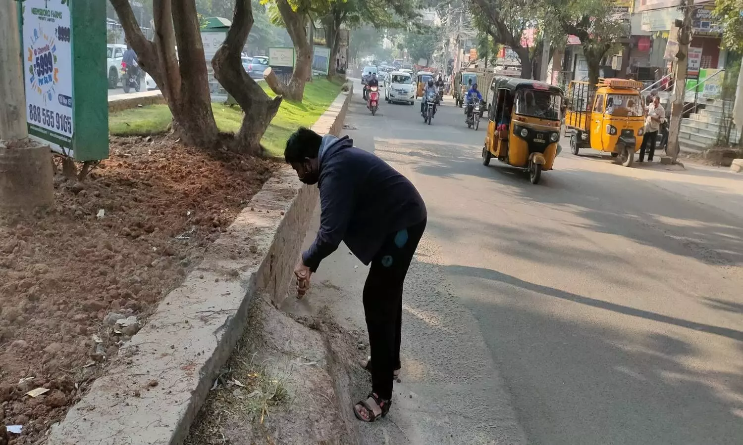 Tired of Nizampet authorities apathy, residents take up cleaning of sand piles on roads