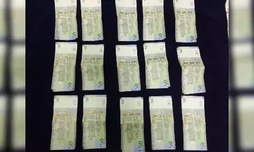 Passenger caught trying to smuggle Oman Riyals worth Rs. 5.17L at RGIA