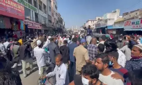 AIMIM members launch protest in Charminar against attack on Owaisi