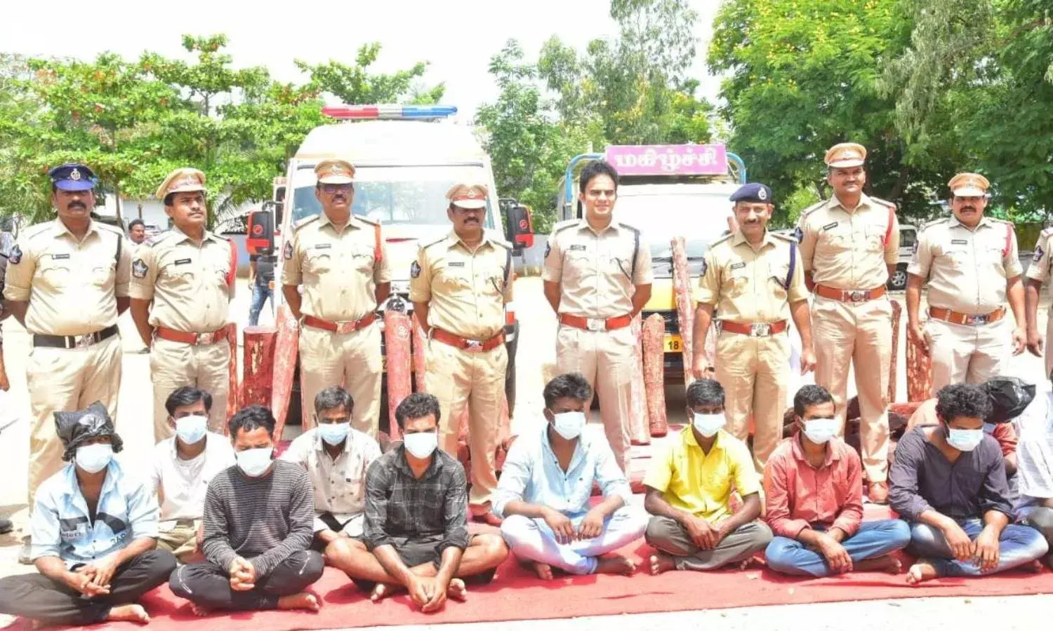 Ambulance loaded with red sanders caught in Chittoor, 71 logs worth Rs. 1 cr seized