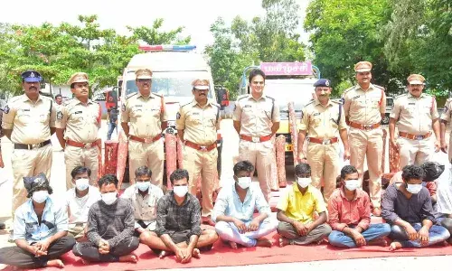 Ambulance loaded with red sanders caught in Chittoor, 71 logs worth Rs. 1 cr seized