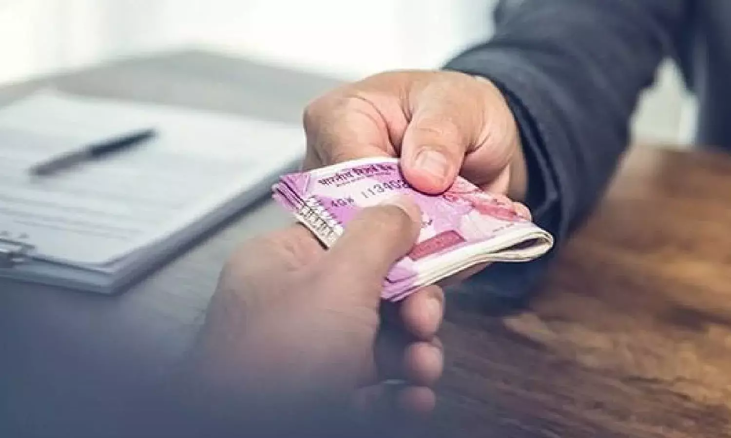 2 tax officials from Hyderabad & Vizag caught accepting bribes