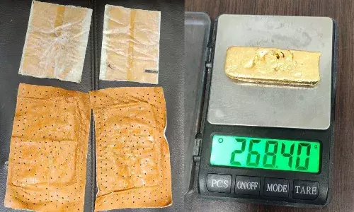 Woman caught at RGIA with gold worth Rs. 13L taped to her body