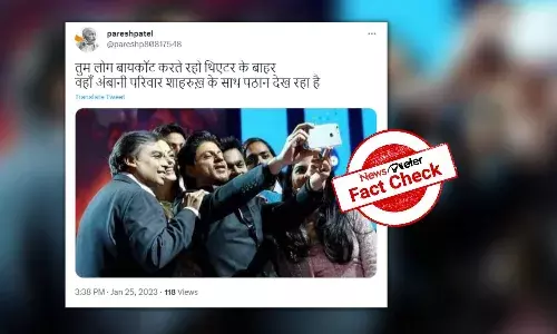 Old photo falsely shared as Ambani family watching ‘Pathaan’ with SRK