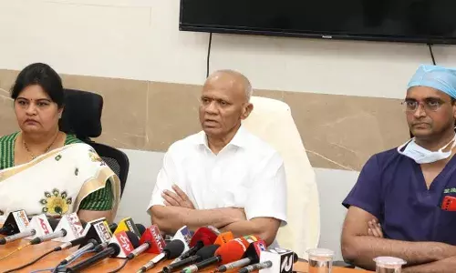 TTD EO Dharma Reddy (middle) speaking to the media in Tirupati.