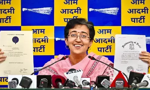 Delhi Education Minister Atishi presenting her degree certificates