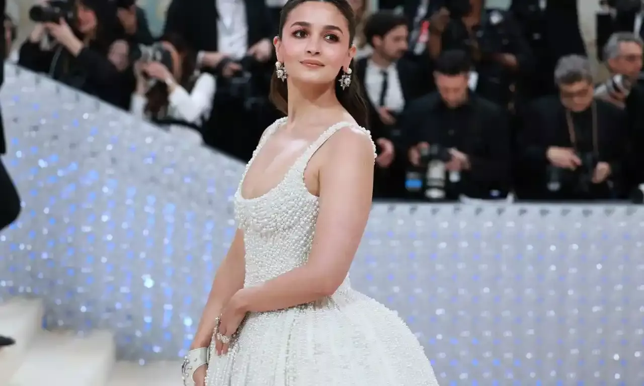 Bollywood star Alia Bhatt dressed in an ivory ball gown embellished with 100,000 pearls hand beaded in India at Met Gala 2023