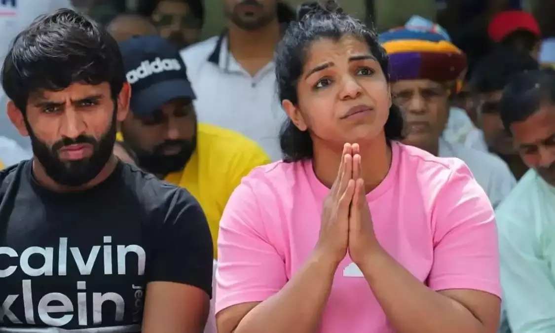 Will continue our fight till we get justice: Sakshi, Bajrang rubbish reports of their withdrawal.