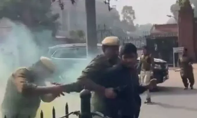 2 protesters were sitting quietly, disrupted House proceedings all of a sudden, eyewitness