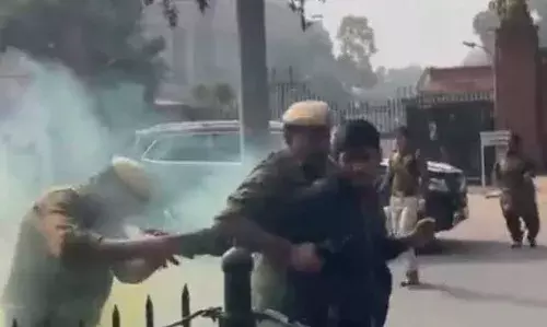 2 protesters were sitting quietly, disrupted House proceedings all of a sudden, eyewitness