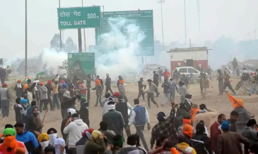 Police lob teargas shells as farmers break Haryana barricades, pelt stones