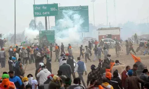 Police lob teargas shells as farmers break Haryana barricades, pelt stones
