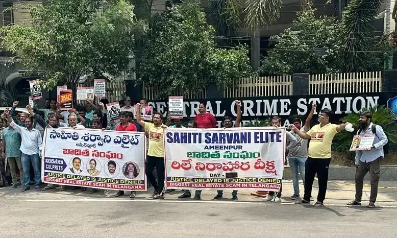 The victims held up posters and a banner featuring the images of the people who they believe are the main culprits.