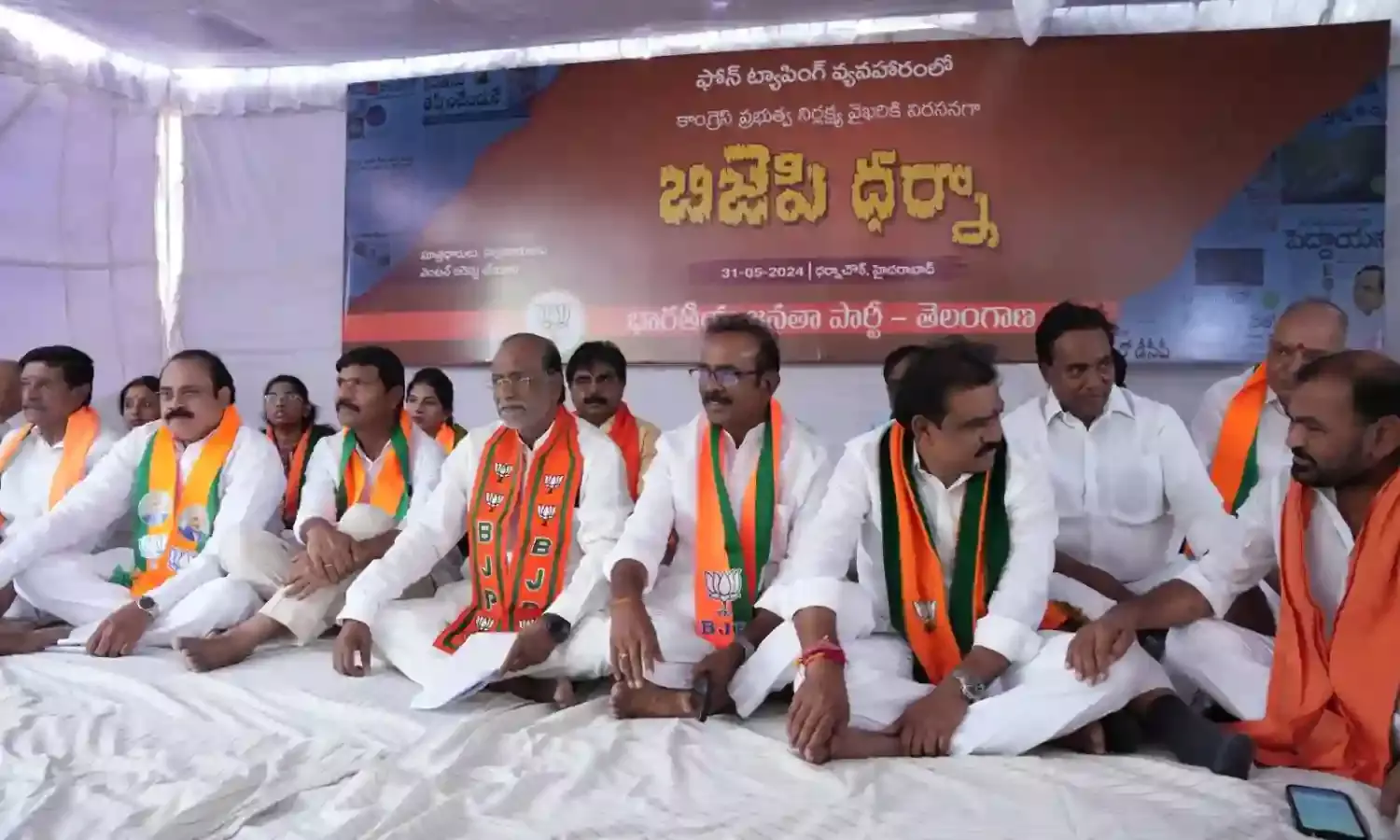 BJP holds dharna seeking CBI probe into phone-tapping during BRS regime