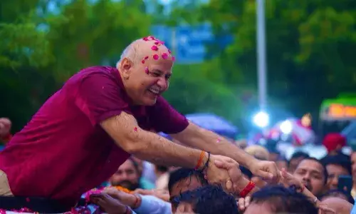 Rain-drenched supporters give Sisodia heros welcome as he walks out of jail after bail