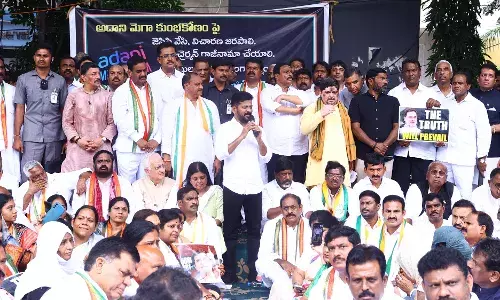 Hindenburg report Telangana CM Revanth Reddy Congress leaders protest outside ED office