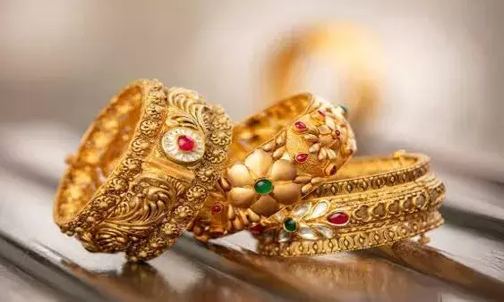 Gold rises Rs 100; silver remains flat