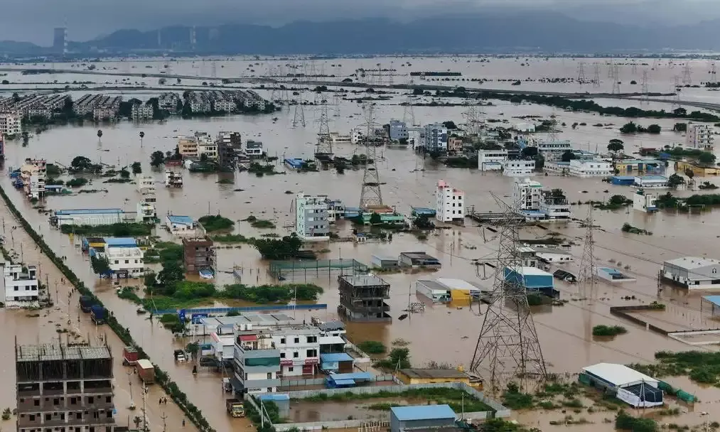 Rains throw life out of gear in Vijayawada with power cuts, traffic disruption