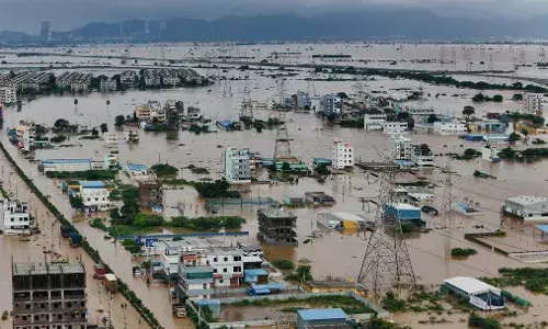 Rains throw life out of gear in Vijayawada with power cuts, traffic disruption