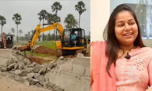 GVMC removes  unauthorized compound wall of Vijay Sai Reddyās daughter Neha Reddy in Bheemunipatnam