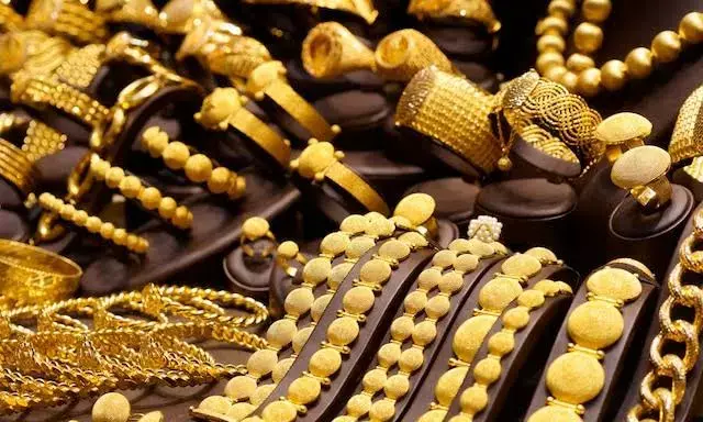 Gold snaps 10-day rally; declines Rs 200 on muted demand