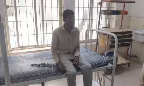 Handcuffed farmerās hospital visit triggers controversy; Telangana CM demands inquiry