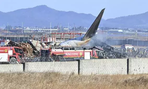 Plane bursts into flames after skidding off runway at airport in South Korea, killing 120 people