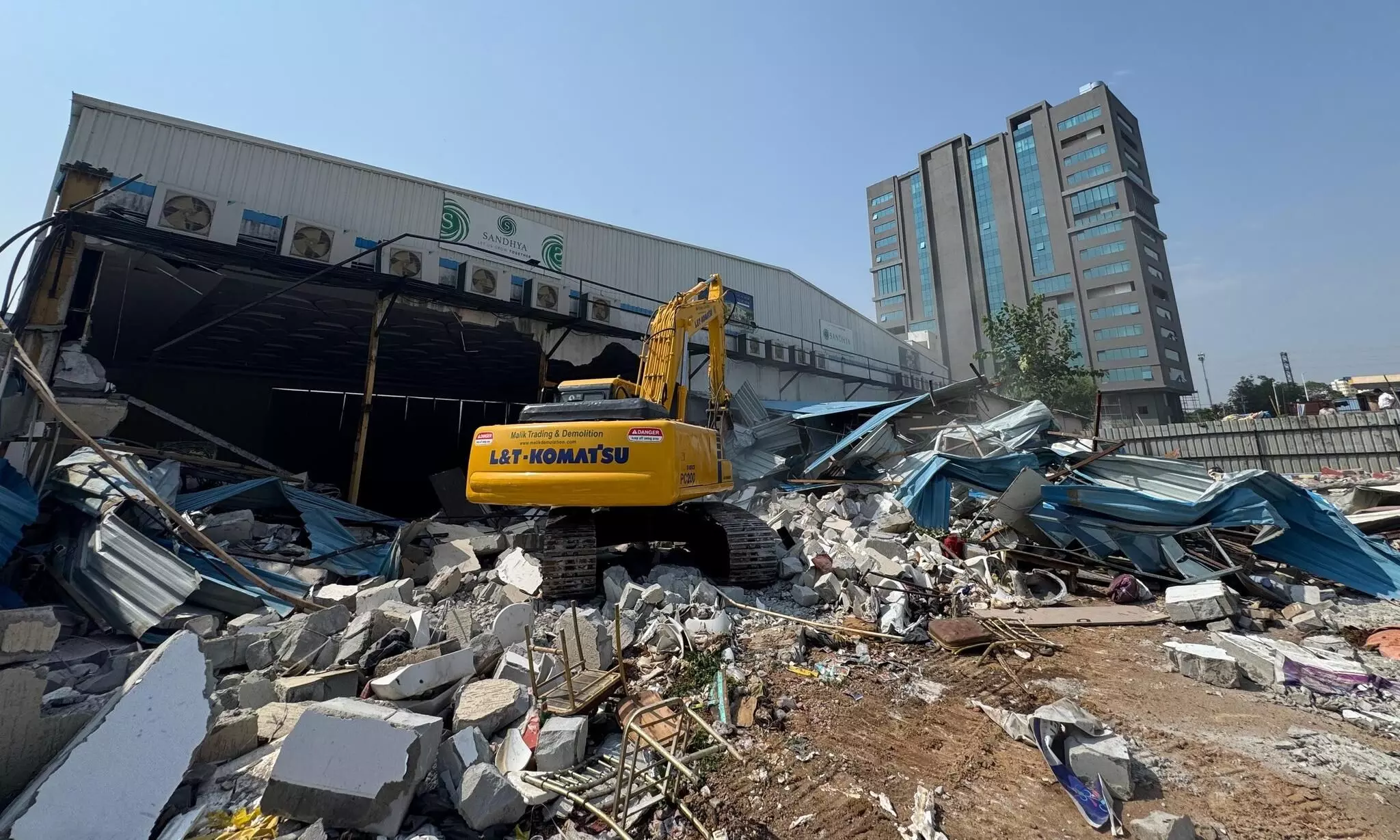 HYDRAA razes unauthorized mini hall, kitchen, restrooms adjacent to Sandhya Convention Center in Gachibowli HYDRAA razes unauthorized mini hall, kitchen, restrooms adjacent to Sandhya Convention Center in Gachibowli