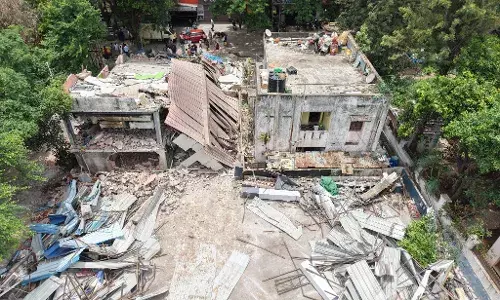 HYDRAA dismantles illegal hostel, car shed in Jubilee Hills, reclaims park area worth over Rs 200 crore