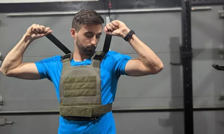 Forget tactical training rooms, weighted vests, sleeveless rigs now grace everyday gyms