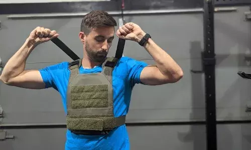 Forget tactical training rooms, weighted vests, sleeveless rigs now grace everyday gyms