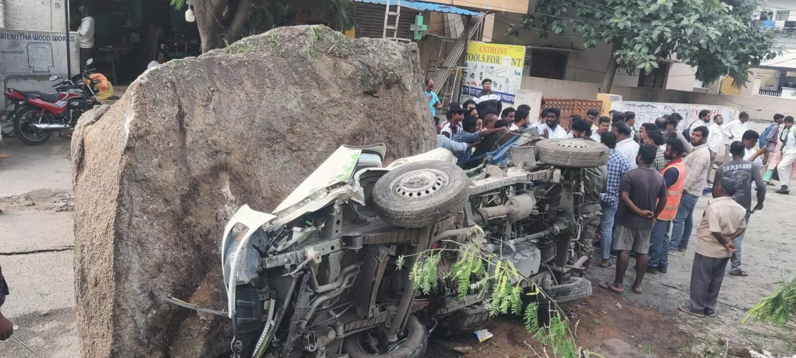 Near disaster in Malkajgiri: Falling boulders hit GHMC vehicle, residents blame illegal constructions Near disaster in Malkajgiri: Falling boulders hit GHMC vehicle, residents blame illegal constructions