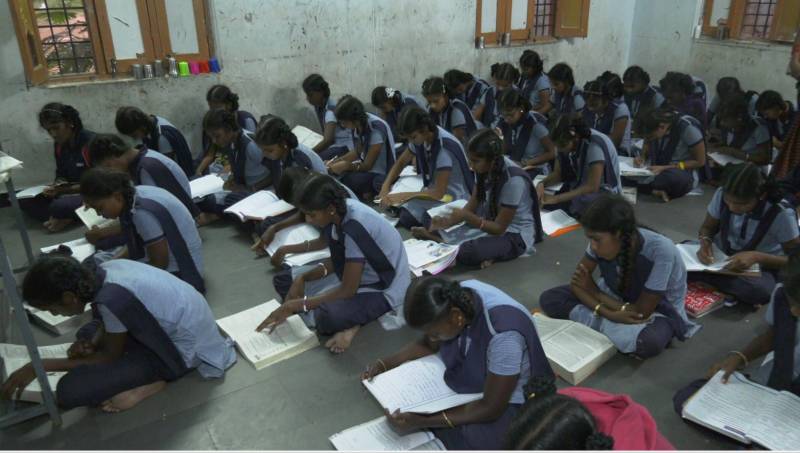 Girls sitting on the floor in Nawabpet KGBV