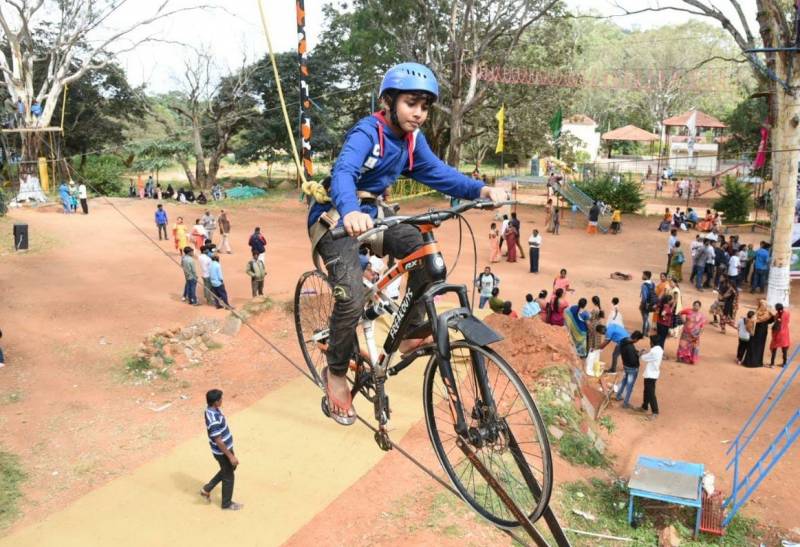 Riding A Bicycle On A Rope In adventure fest