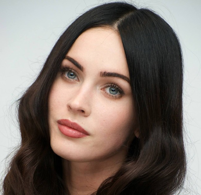 celebrities with black hair and green eyes